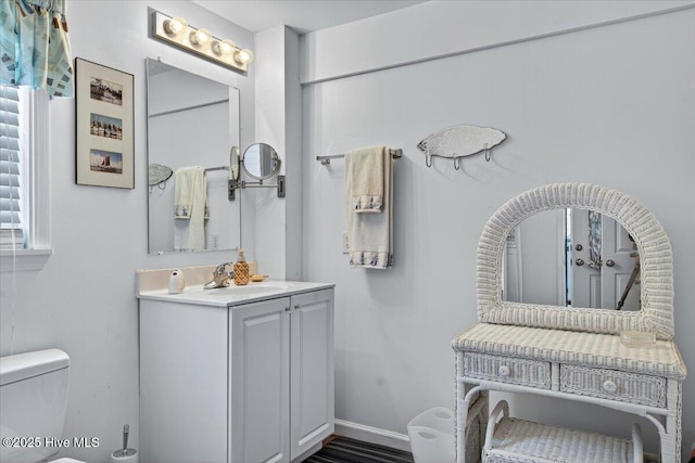 104 NE 27th St, Oak Island, NC 28465 - bathroom with vanity and toilet