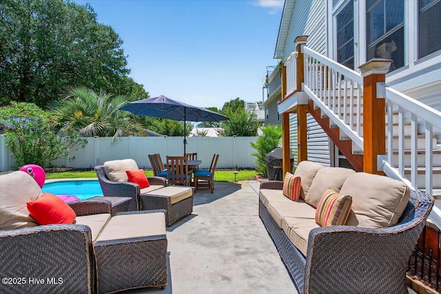 104 NE 27th St, Oak Island, NC 28465 - fenced backyard featuring an outdoor living space, a patio, and outdoor dining area