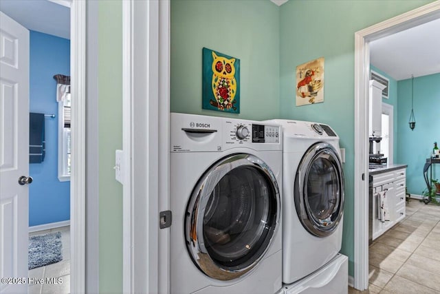 104 NE 27th St, Oak Island, NC 28465 - laundry room featuring washer and dryer and light tile patterned flooring