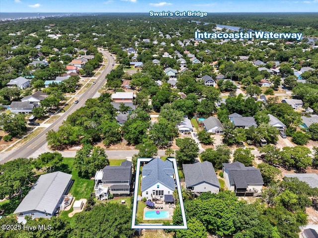 104 NE 27th St, Oak Island, NC 28465 - aerial perspective of suburban area with property boundaries highlighted and a pool