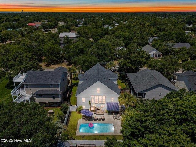 104 NE 27th St, Oak Island, NC 28465 - aerial view at dusk of view of pool area