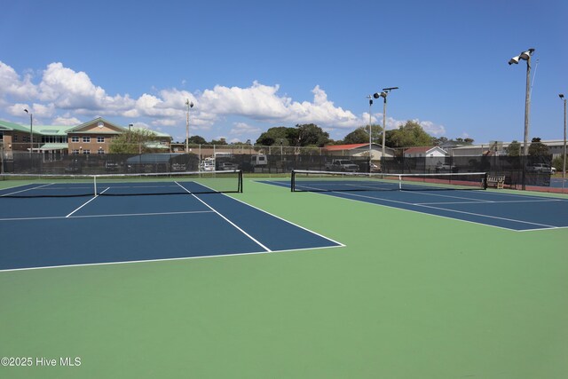 104 NE 27th St, Oak Island, NC 28465 - view of tennis court featuring community basketball court
