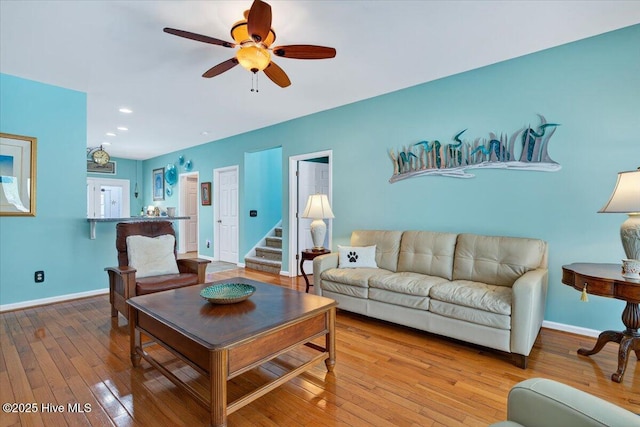 104 NE 27th St, Oak Island, NC 28465 - living room with hardwood / wood-style floors, stairway, a ceiling fan, and recessed lighting