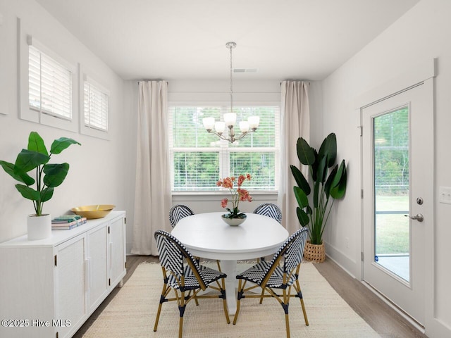 28 Legare St Lot 173, Wilmington, NC 28411 - dining room featuring light wood-style floors, a chandelier, and healthy amount of natural light