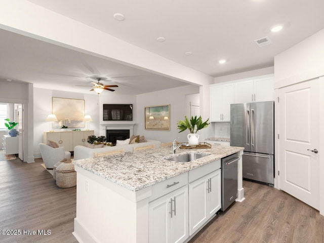 28 Legare St Lot 173, Wilmington, NC 28411 - kitchen with appliances with stainless steel finishes, white cabinetry, wood finished floors, a ceiling fan, and recessed lighting