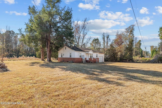 9626 NC Highway 50, Maple Hill, NC 28454 - view of grassy yard featuring a garage