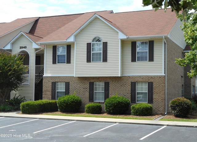 2940 Mulberry Ln Unit B, Greenville, NC 27858 - view of property featuring uncovered parking and brick siding