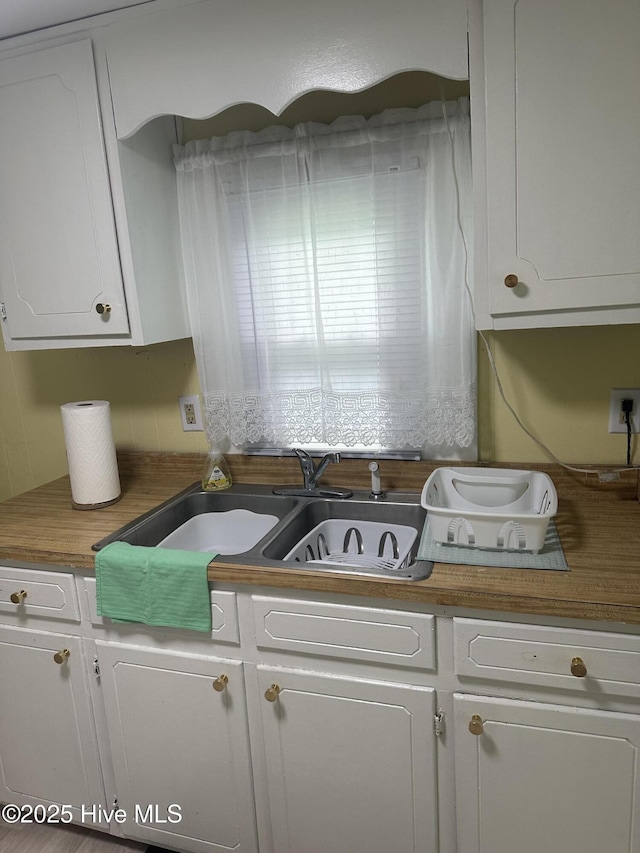 410 Brown Dr, New Bern, NC 28560 - kitchen featuring white cabinetry