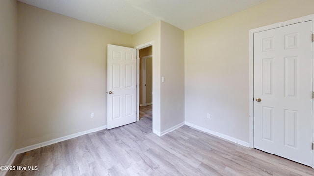 973 Ramsey Rd, Jacksonville, NC 28546 - unfurnished bedroom with light wood-style floors and baseboards