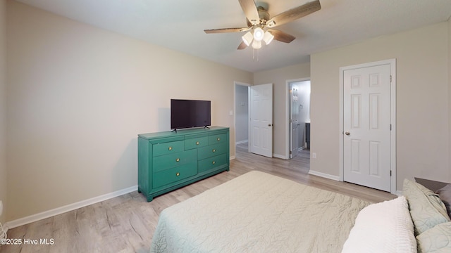 973 Ramsey Rd, Jacksonville, NC 28546 - bedroom with light wood-type flooring, ensuite bath, and a ceiling fan