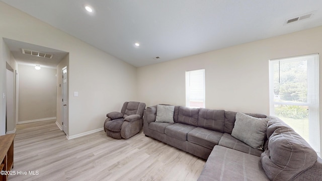 973 Ramsey Rd, Jacksonville, NC 28546 - living room with light wood-type flooring, vaulted ceiling, and recessed lighting