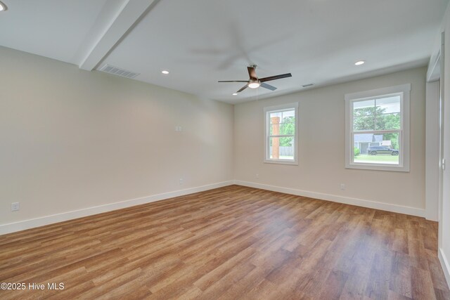 1536 Dorsey Ln, Navassa, NC 28451 - empty room with light wood finished floors, recessed lighting, ceiling fan, and beam ceiling