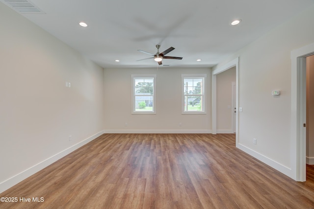 1536 Dorsey Ln, Navassa, NC 28451 - unfurnished room with wood finished floors, a ceiling fan, and recessed lighting