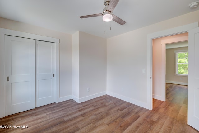 1536 Dorsey Ln, Navassa, NC 28451 - unfurnished bedroom featuring light wood-type flooring, a closet, and ceiling fan