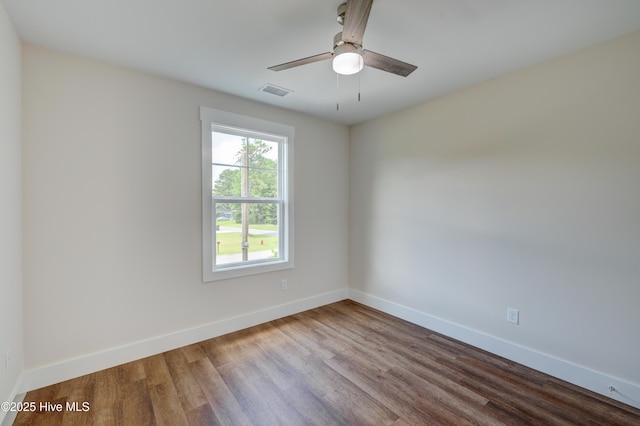 1536 Dorsey Ln, Navassa, NC 28451 - empty room with wood finished floors and a ceiling fan