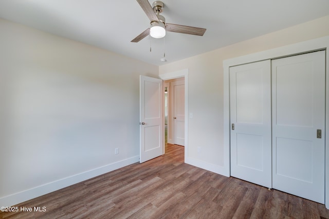 1536 Dorsey Ln, Navassa, NC 28451 - unfurnished bedroom with wood finished floors, a closet, and a ceiling fan