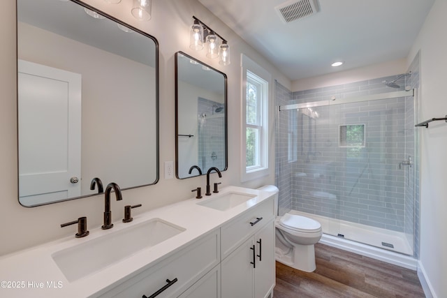 1536 Dorsey Ln, Navassa, NC 28451 - full bath with a tile shower, double vanity, wood finished floors, and recessed lighting