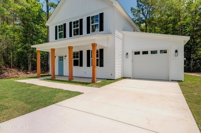 1536 Dorsey Ln, Navassa, NC 28451 - modern farmhouse style home featuring covered porch, a garage, a front lawn, and driveway
