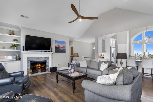 611 New River Inlet Rd, North Topsail Beach, NC 28460 - living area with ceiling fan, high vaulted ceiling, wood finished floors, and a fireplace