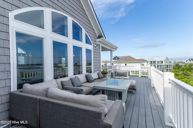 611 New River Inlet Rd, North Topsail Beach, NC 28460 - wooden deck featuring an outdoor living space