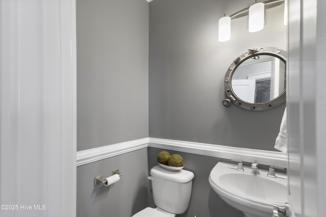 611 New River Inlet Rd, North Topsail Beach, NC 28460 - bathroom with toilet and a sink