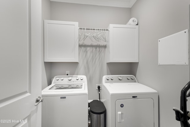 611 New River Inlet Rd, North Topsail Beach, NC 28460 - washroom with washer and clothes dryer and cabinet space