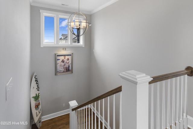 611 New River Inlet Rd, North Topsail Beach, NC 28460 - stairs featuring a chandelier, wood finished floors, and crown molding