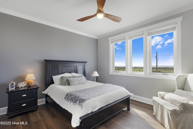 611 New River Inlet Rd, North Topsail Beach, NC 28460 - bedroom with crown molding, dark wood finished floors, and a ceiling fan