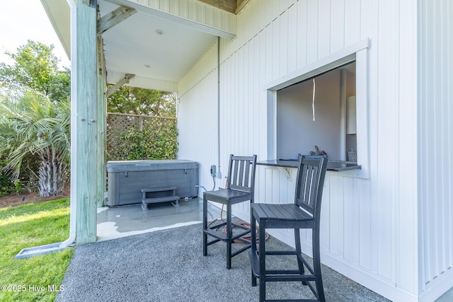611 New River Inlet Rd, North Topsail Beach, NC 28460 - view of patio / terrace with a hot tub