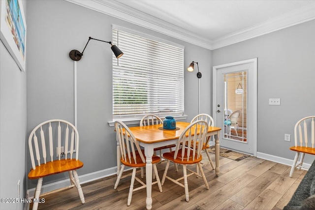 280 Woodlands Way Unit 5, Calabash, NC 28467 - dining space with crown molding and wood finished floors