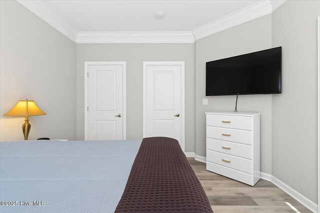 280 Woodlands Way Unit 5, Calabash, NC 28467 - bedroom with ornamental molding and light wood-style flooring