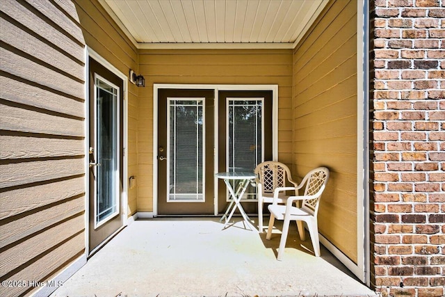 280 Woodlands Way Unit 5, Calabash, NC 28467 - doorway to property featuring a patio and brick siding