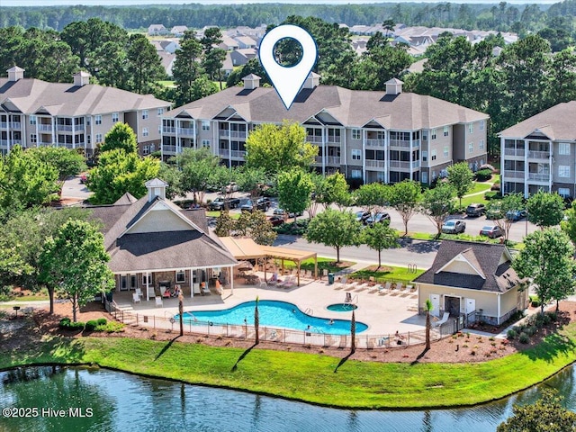 280 Woodlands Way Unit 5, Calabash, NC 28467 - drone / aerial view of a pool area and a nearby body of water