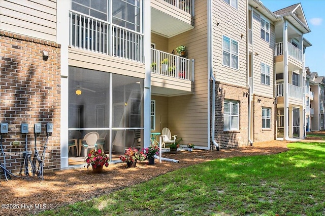 280 Woodlands Way Unit 5, Calabash, NC 28467 - back of house featuring brick siding and a yard