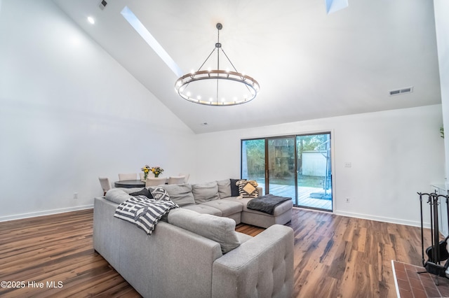 6017 Covenant Ln, Wilmington, NC 28403 - living room featuring a chandelier, wood finished floors, and high vaulted ceiling