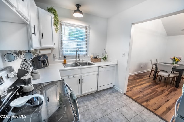 6017 Covenant Ln, Wilmington, NC 28403 - kitchen featuring electric stove, white dishwasher, light tile patterned flooring, white cabinets, and light countertops