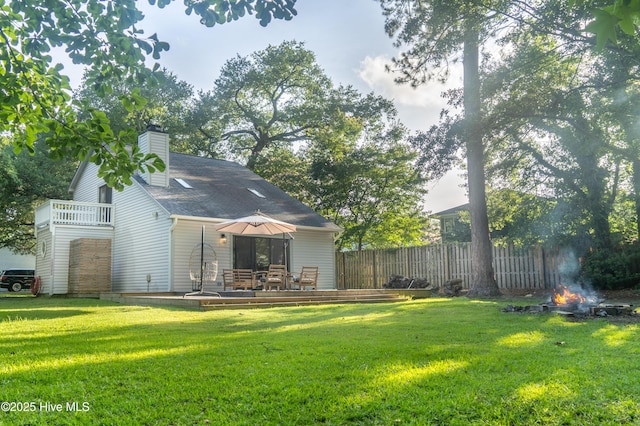 6017 Covenant Ln, Wilmington, NC 28403 - rear view of house with a chimney and a wooden deck