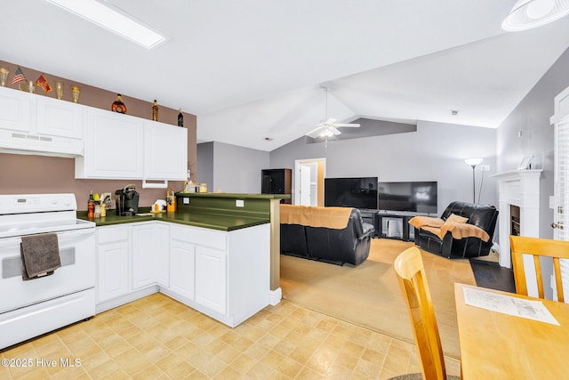 529 Maple Branches Dr, Leland, NC 28451 - kitchen with white electric stove, under cabinet range hood, a peninsula, a ceiling fan, and white cabinets