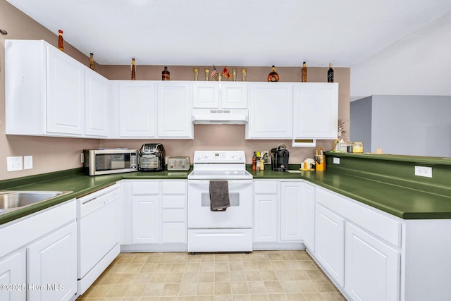 529 Maple Branches Dr, Leland, NC 28451 - kitchen featuring white appliances, under cabinet range hood, dark countertops, a peninsula, and white cabinets