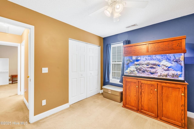529 Maple Branches Dr, Leland, NC 28451 - bedroom featuring light colored carpet, a closet, and ceiling fan