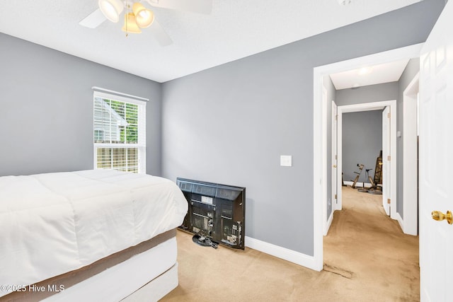 529 Maple Branches Dr, Leland, NC 28451 - carpeted bedroom with baseboards and a ceiling fan