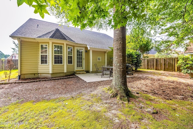 529 Maple Branches Dr, Leland, NC 28451 - rear view of house featuring roof with shingles and a patio