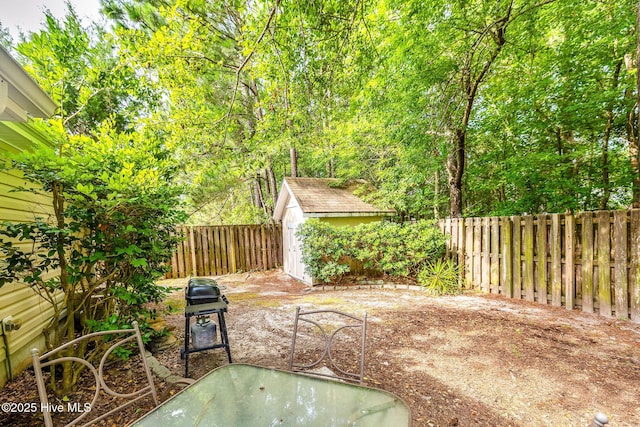 529 Maple Branches Dr, Leland, NC 28451 - fenced backyard featuring a storage unit