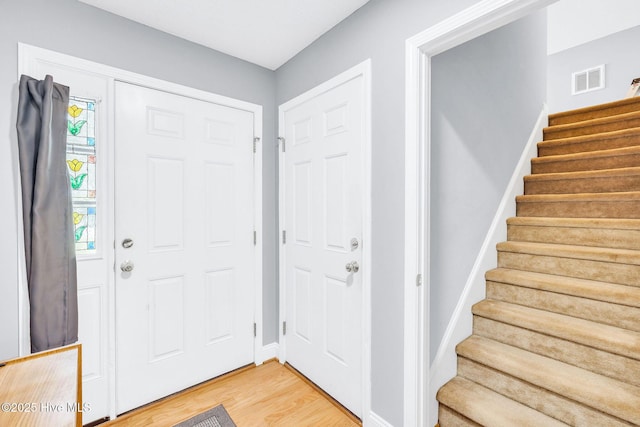 529 Maple Branches Dr, Leland, NC 28451 - entryway with light wood-style floors and stairs
