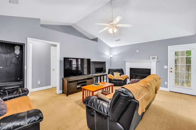 529 Maple Branches Dr, Leland, NC 28451 - living room with light carpet, lofted ceiling, a glass covered fireplace, and ceiling fan