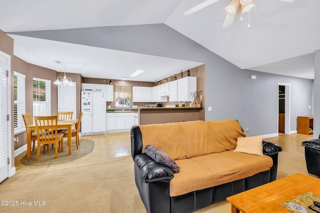 529 Maple Branches Dr, Leland, NC 28451 - living area with vaulted ceiling, ceiling fan, light tile patterned floors, and light colored carpet