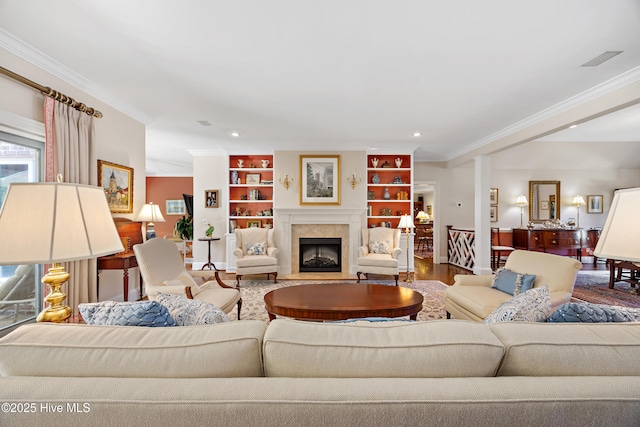 2000 Marsh Harbor Pl, Wilmington, NC 28405 - living area featuring crown molding, a fireplace with flush hearth, recessed lighting, built in features, and wood finished floors