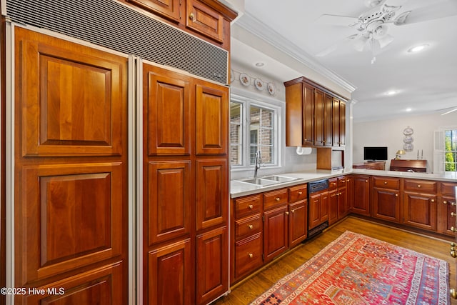 2000 Marsh Harbor Pl, Wilmington, NC 28405 - kitchen with crown molding, wood finished floors, ceiling fan, paneled built in refrigerator, and light countertops