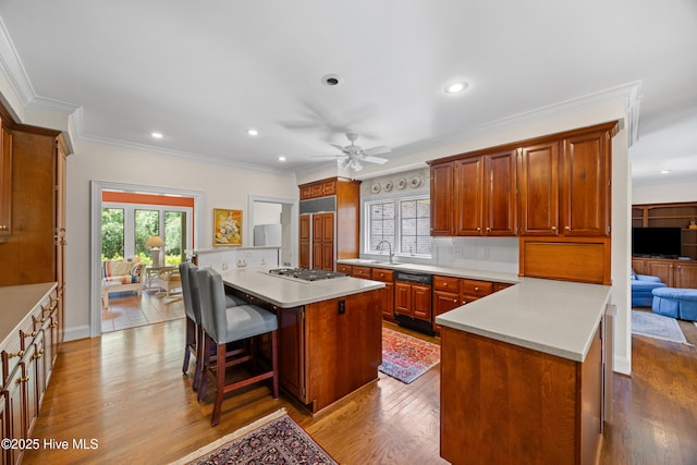 2000 Marsh Harbor Pl, Wilmington, NC 28405 - kitchen featuring gas cooktop, a center island, wood finished floors, light countertops, and recessed lighting
