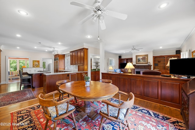 2000 Marsh Harbor Pl, Wilmington, NC 28405 - dining space with ceiling fan, recessed lighting, wood finished floors, decorative columns, and ornamental molding